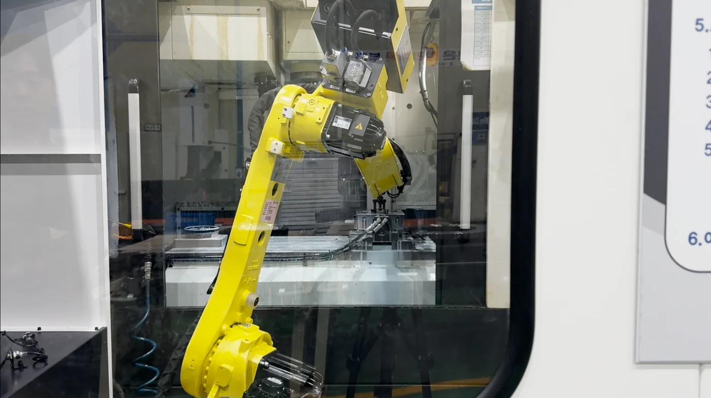 Industrial robot working inside an automated manufacturing cell